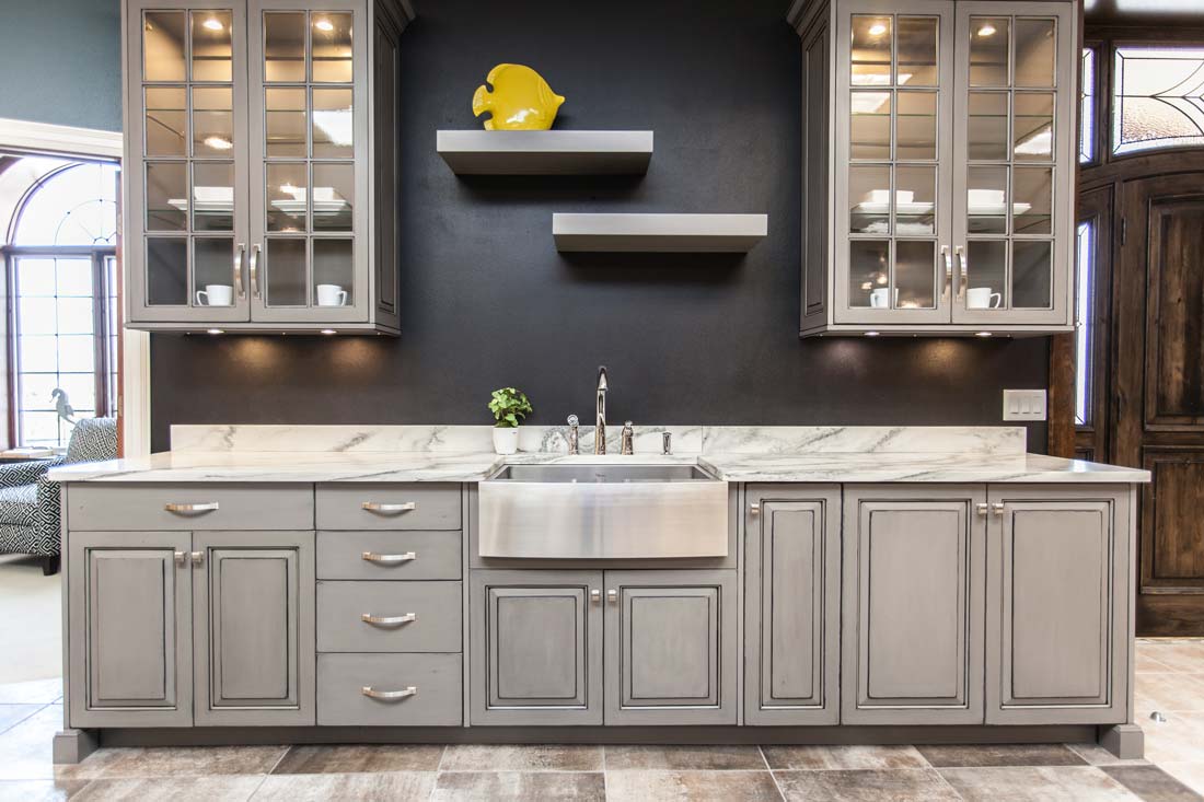 Grey kitchen cabinets with Carrara Marble countertops in Fairfield, Iowa