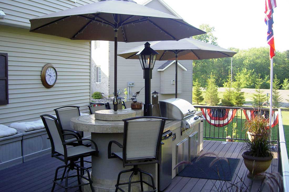 Deck with a Kitchen and Area for Seating by JC Huffman in Fairfield, Iowa