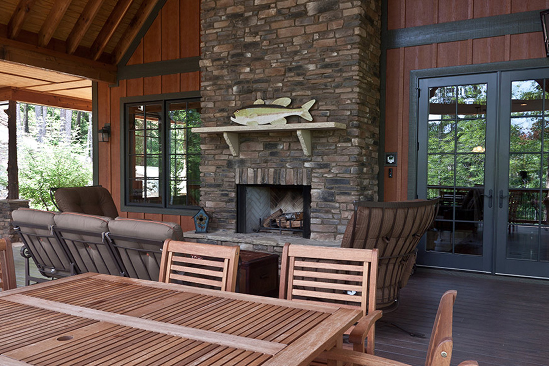 Outdoor Living Area with Stone Fireplace by JC Huffman in Fairfield, Iowa