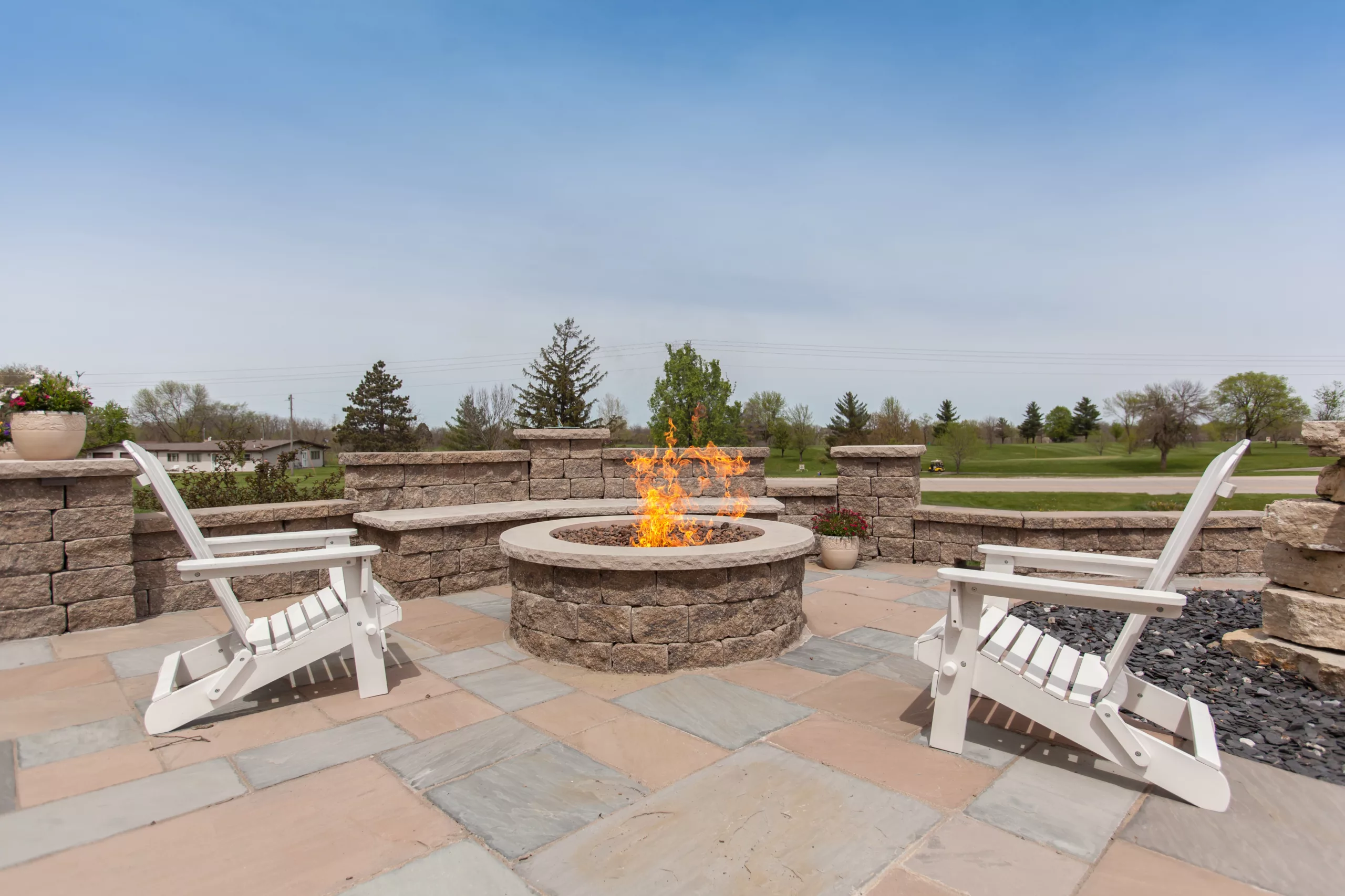 Building an Outdoor fireplace or firepit out of stone to relax in front of on a cool summer’s night
