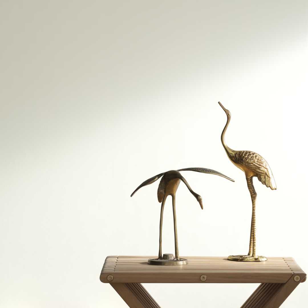 Benjamin Moore Simply White painted wall by bird sculpture.