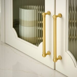 White and glass cabinets with gold Top Knobs hardware.