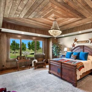 Reclaimed barnwood used on a bedroom ceiling.