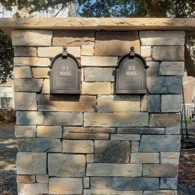 Stone veneer mailbox.