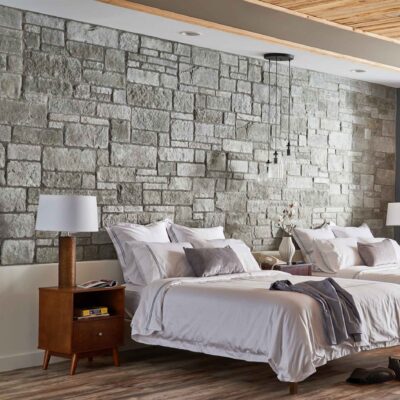 Gray stone wall in a bedroom.