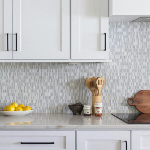 Daltile backsplash tile features polished stone randomly mixed with glass in polished and frosted finishes.