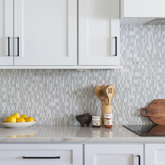 Daltile backsplash tile features polished stone randomly mixed with glass in polished and frosted finishes.