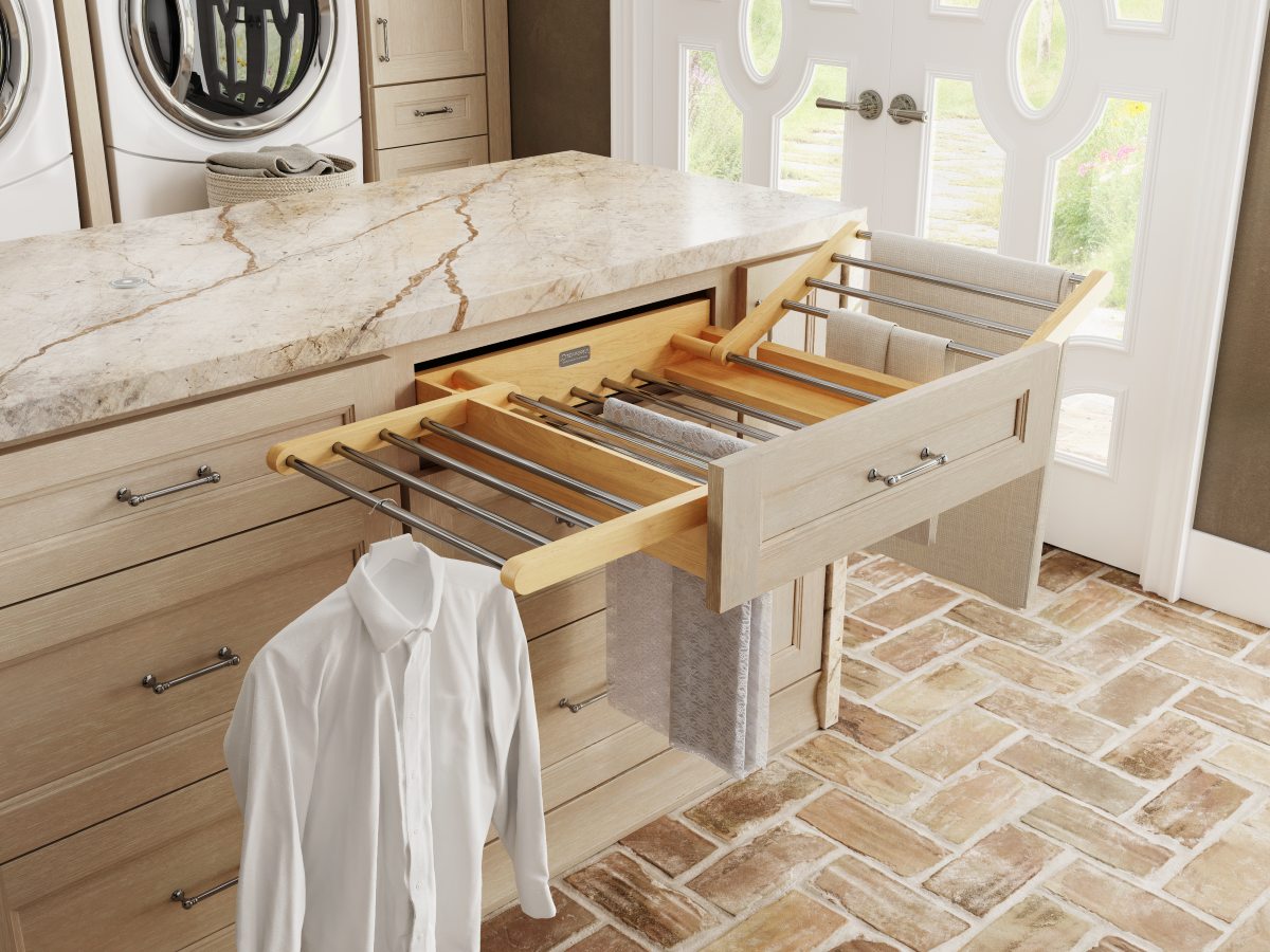 pull-out-drying-rack-laundry-room-cabinetry Pull out drying rack built into custom laundry room cabinetry for air drying clothing while saving floor space.